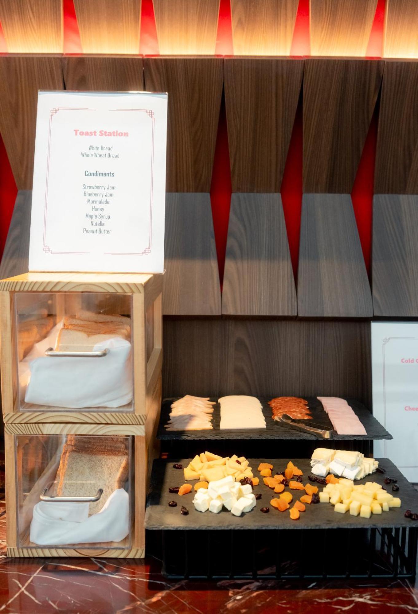 Ascott Embassy Sathorn Bangkok Hotel Bagian luar foto A selection of cheese at a buffet